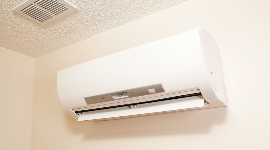 Ductless mini split air conditioner installed on a wall, showcasing energy-efficient cooling and heating solution for homes in Waterford Township, MI.